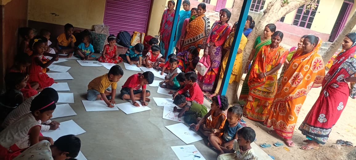 Children displaying art camp work
